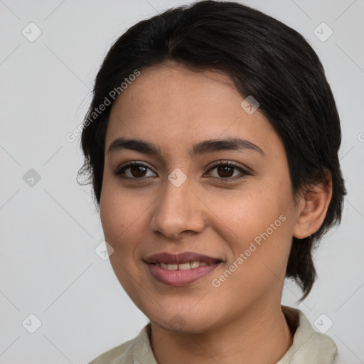 Joyful latino young-adult female with medium  brown hair and brown eyes