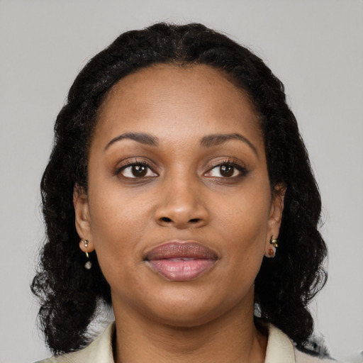 Joyful black young-adult female with medium  black hair and brown eyes