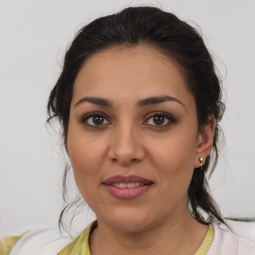 Joyful white young-adult female with medium  brown hair and brown eyes