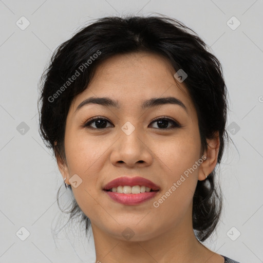 Joyful asian young-adult female with medium  black hair and brown eyes