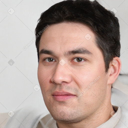 Joyful white adult male with short  black hair and brown eyes