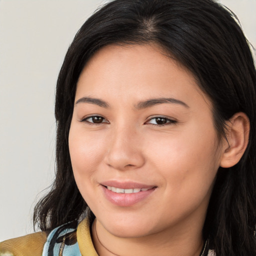 Joyful white young-adult female with long  brown hair and brown eyes