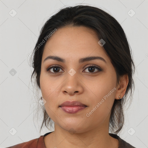 Joyful latino young-adult female with medium  black hair and brown eyes