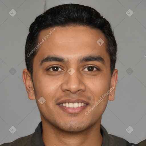 Joyful latino young-adult male with short  black hair and brown eyes