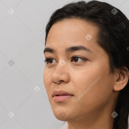 Joyful asian young-adult female with medium  black hair and brown eyes