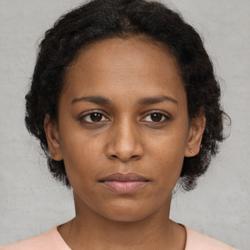 Neutral black young-adult female with short  brown hair and brown eyes