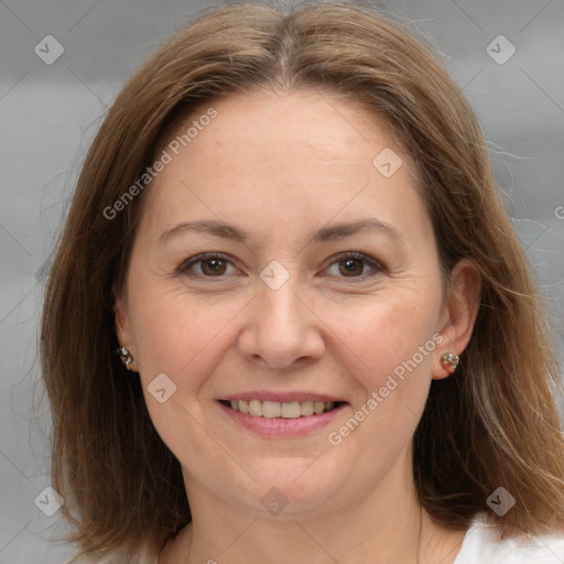 Joyful white adult female with medium  brown hair and grey eyes