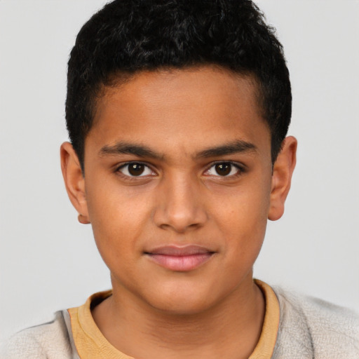 Joyful latino child male with short  brown hair and brown eyes