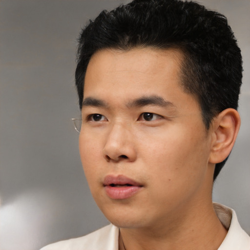 Neutral asian young-adult male with short  black hair and brown eyes