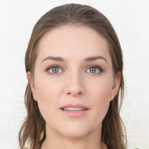 Joyful white young-adult female with long  brown hair and grey eyes