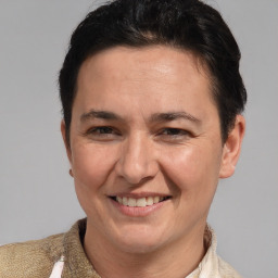 Joyful white adult female with short  brown hair and brown eyes