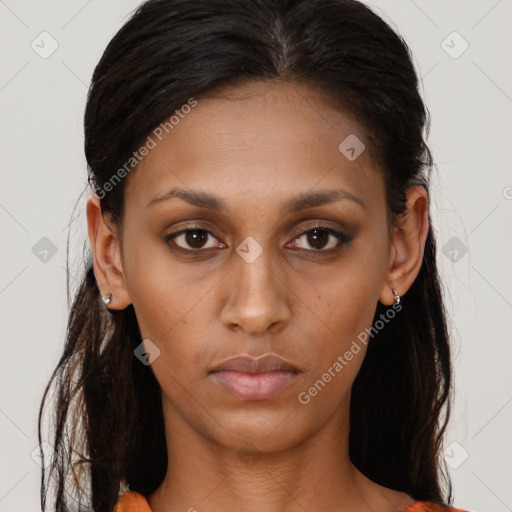 Neutral black young-adult female with long  brown hair and brown eyes