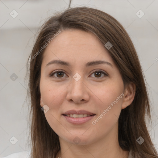 Joyful white adult female with long  brown hair and brown eyes