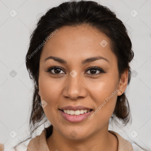 Joyful latino young-adult female with medium  brown hair and brown eyes