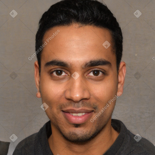 Joyful white young-adult male with short  black hair and brown eyes