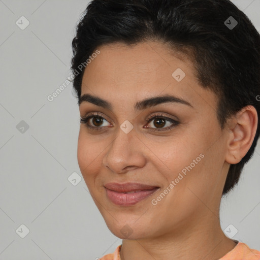 Joyful latino young-adult female with short  brown hair and brown eyes