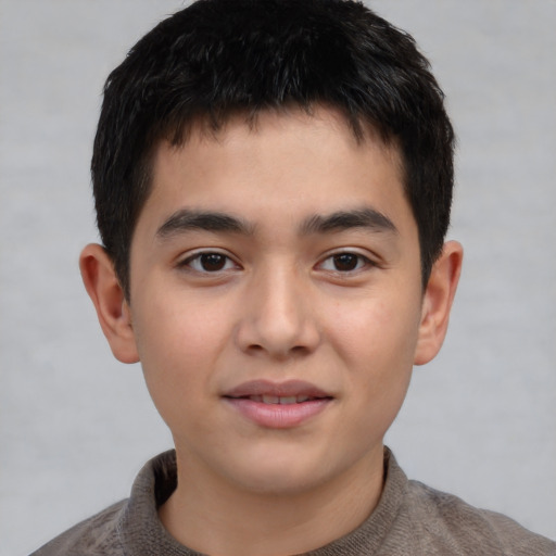 Joyful white child male with short  brown hair and brown eyes