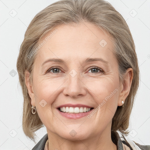 Joyful white adult female with medium  brown hair and grey eyes