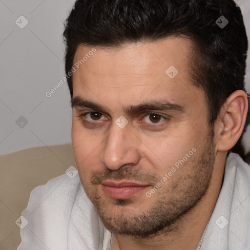 Joyful white adult male with short  brown hair and brown eyes