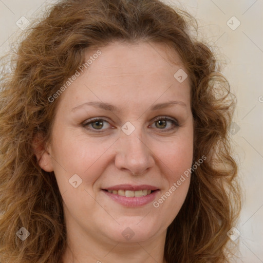 Joyful white adult female with long  brown hair and brown eyes