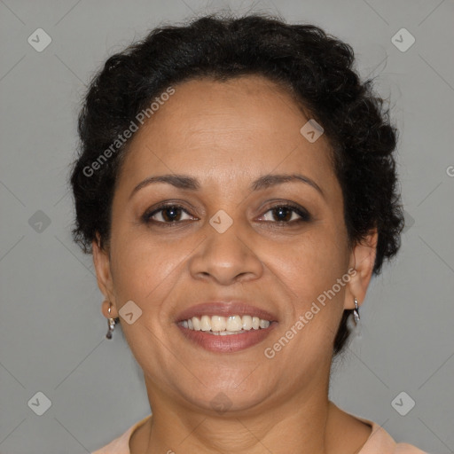 Joyful latino adult female with short  brown hair and brown eyes