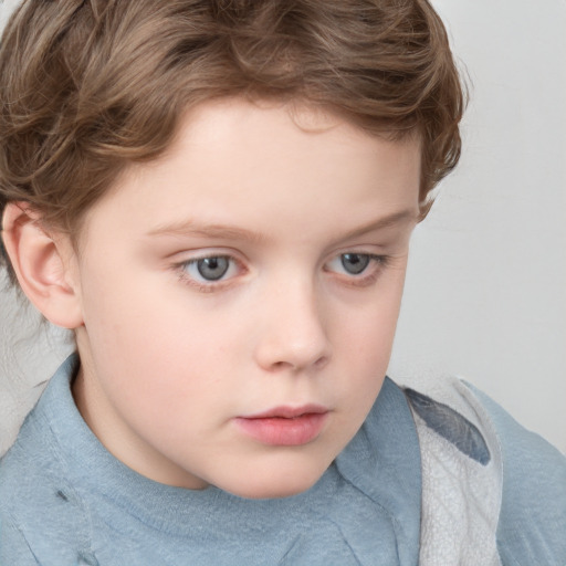 Neutral white child male with short  brown hair and blue eyes