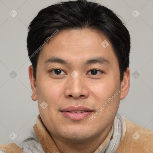 Joyful asian young-adult male with short  brown hair and brown eyes