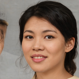 Joyful asian young-adult female with medium  brown hair and brown eyes