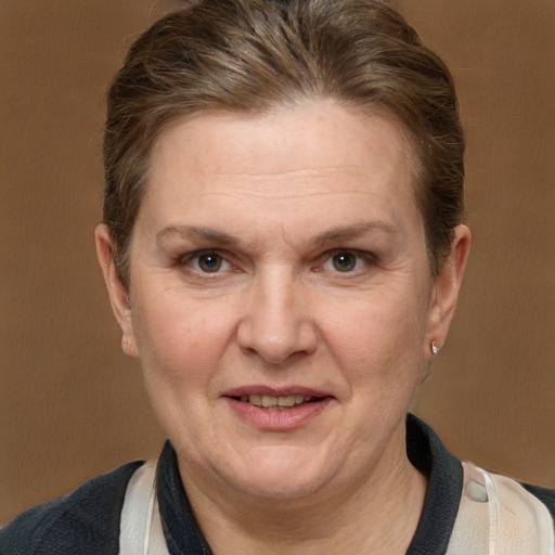 Joyful white adult female with medium  brown hair and grey eyes