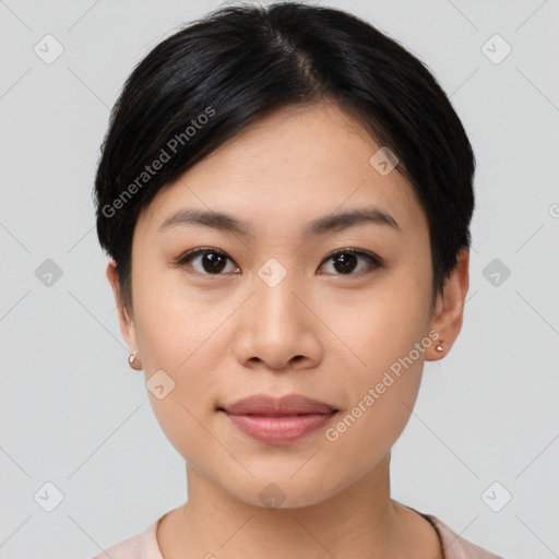 Joyful asian young-adult female with short  black hair and brown eyes