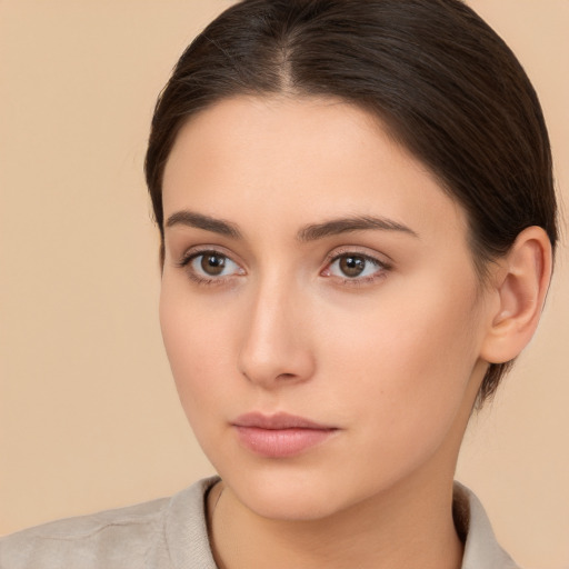 Neutral white young-adult female with medium  brown hair and brown eyes