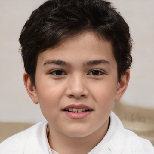 Joyful white child male with short  brown hair and brown eyes