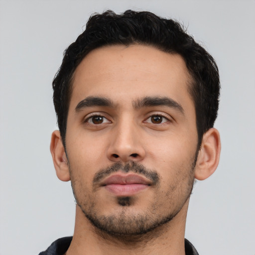 Neutral latino young-adult male with short  black hair and brown eyes