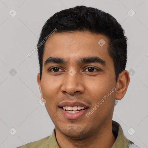 Joyful latino young-adult male with short  black hair and brown eyes