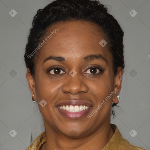 Joyful black young-adult female with short  brown hair and brown eyes