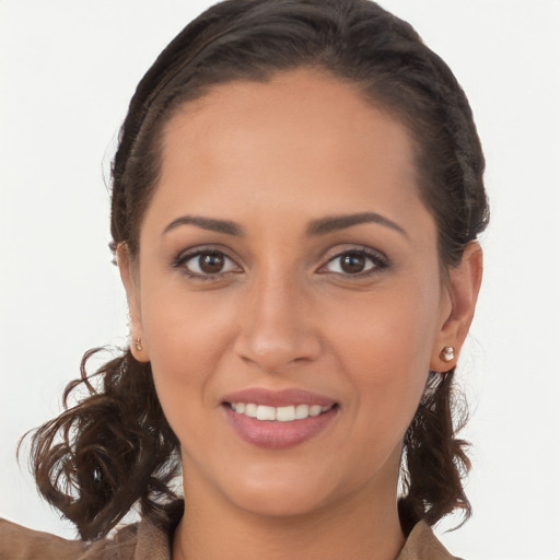 Joyful white young-adult female with long  brown hair and brown eyes