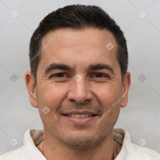 Joyful white adult male with short  brown hair and brown eyes