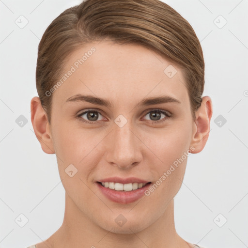 Joyful white young-adult female with short  brown hair and grey eyes