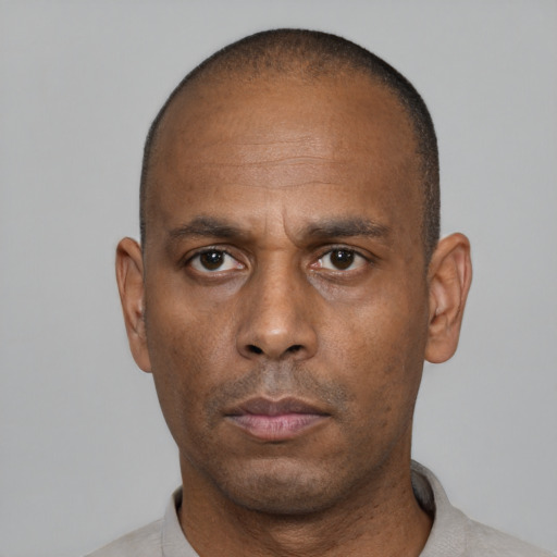 Neutral black adult male with short  black hair and brown eyes