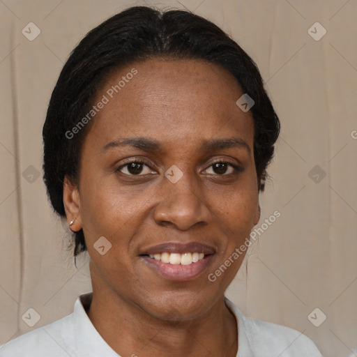 Joyful black young-adult female with short  brown hair and brown eyes