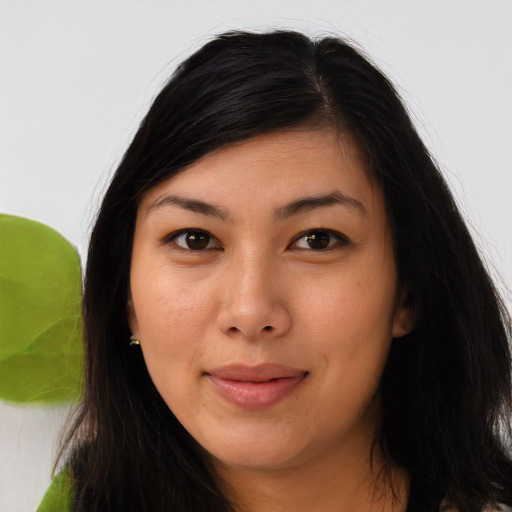Joyful asian young-adult female with long  brown hair and brown eyes