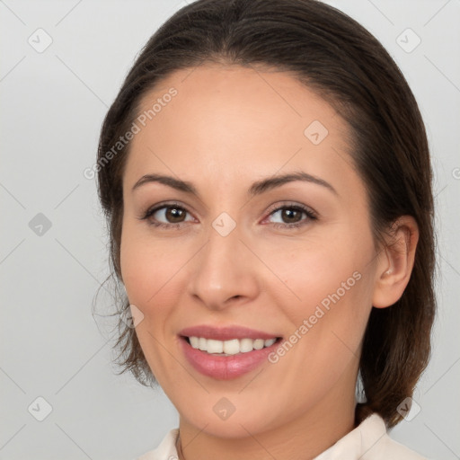 Joyful white young-adult female with medium  brown hair and brown eyes