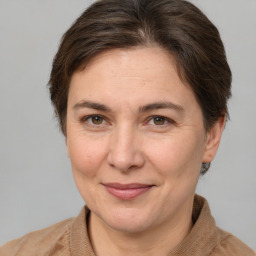 Joyful white adult female with short  brown hair and brown eyes