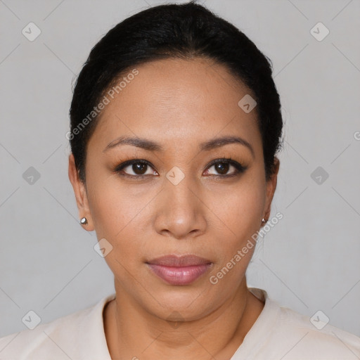 Joyful latino young-adult female with short  black hair and brown eyes