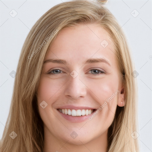 Joyful white young-adult female with long  brown hair and blue eyes