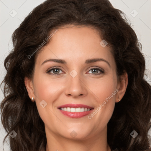 Joyful white adult female with long  brown hair and brown eyes