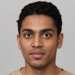 Neutral latino young-adult male with short  black hair and brown eyes