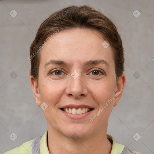 Joyful white young-adult female with short  brown hair and grey eyes