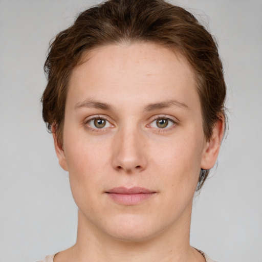 Neutral white young-adult female with short  brown hair and green eyes