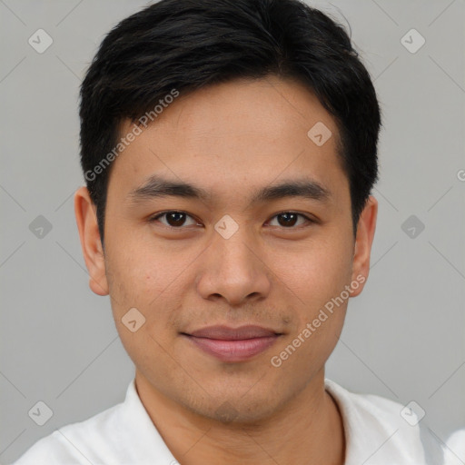 Joyful asian young-adult male with short  brown hair and brown eyes